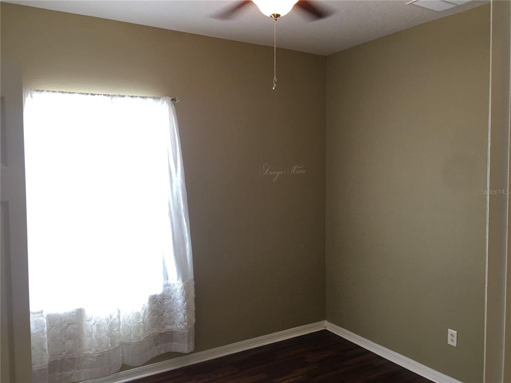 18047 Java Isle Drive Tampa, FL 33647 - Photo 19 of 21 a view of a small space with wooden floor and a window