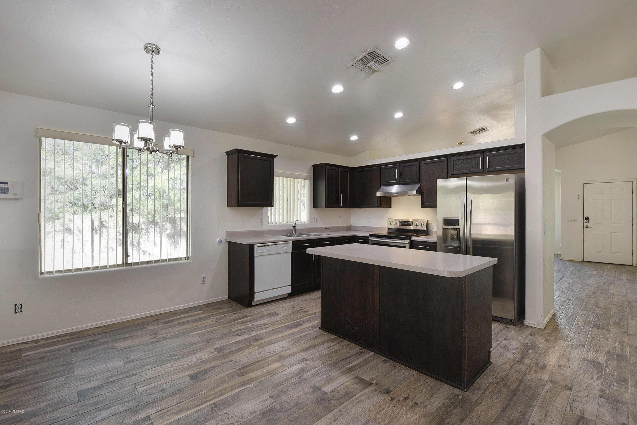 4328 South Valley Road Tucson, AZ 85714 - Photo 8 of 29 a kitchen with stainless steel appliances granite countertop a sink stove and refrigerator