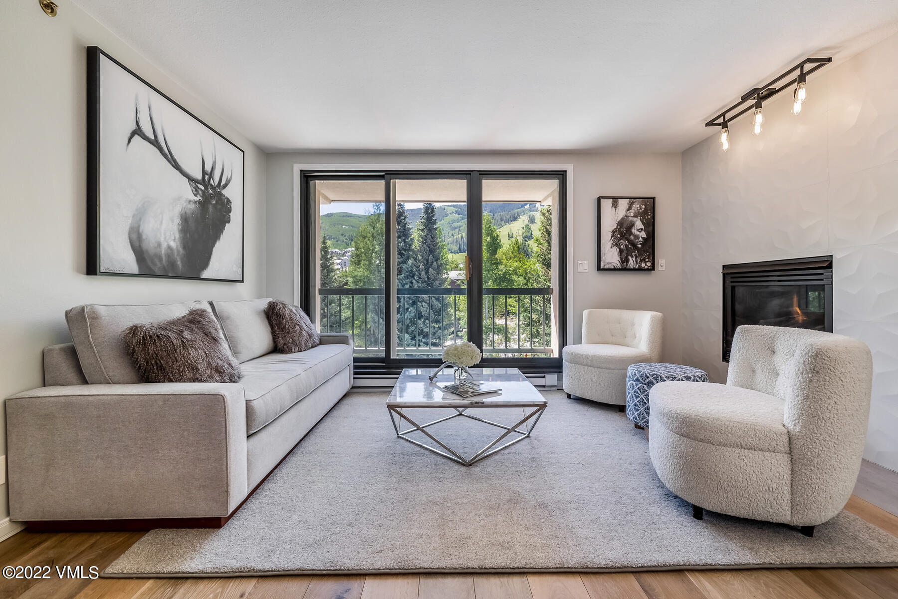 1120 Village Road, Unit 402 Beaver Creek, CO 81620 - Photo 2 of 46 a living room with furniture and a large window