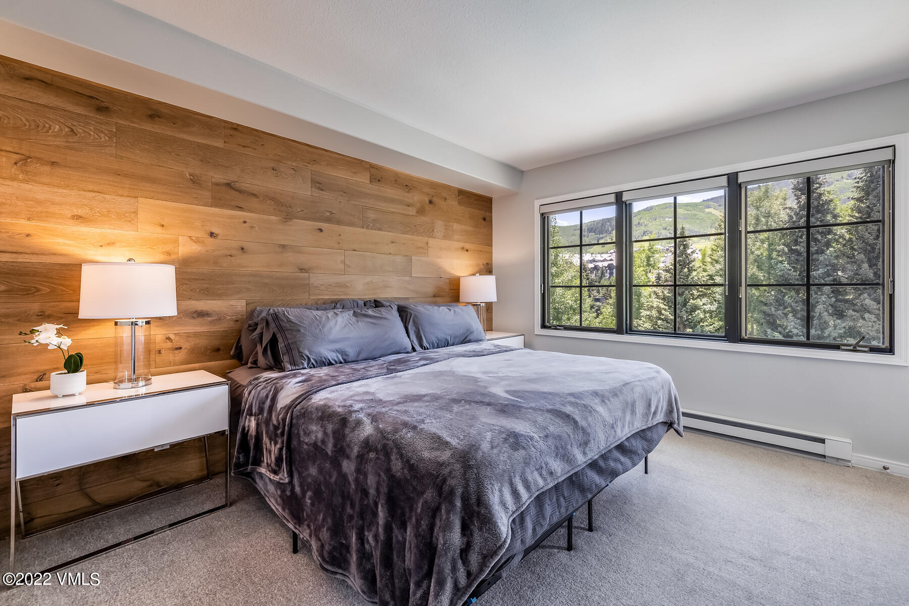 1120 Village Road, Unit 402 Beaver Creek, CO 81620 - Photo 23 of 46 a bed sitting in a bedroom next to a window