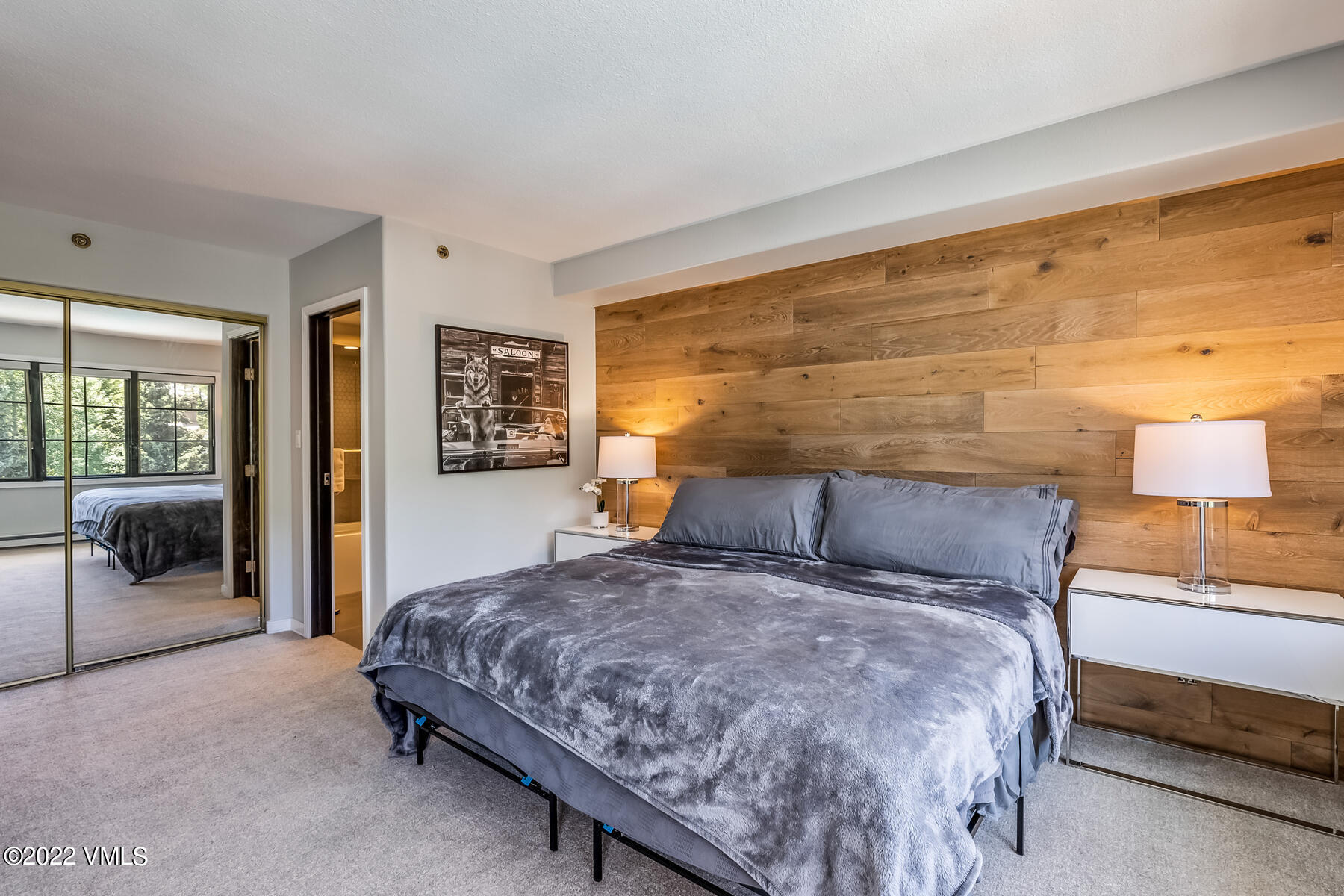 1120 Village Road, Unit 402 Beaver Creek, CO 81620 - Photo 24 of 46 a bedroom with a large bed and a couch