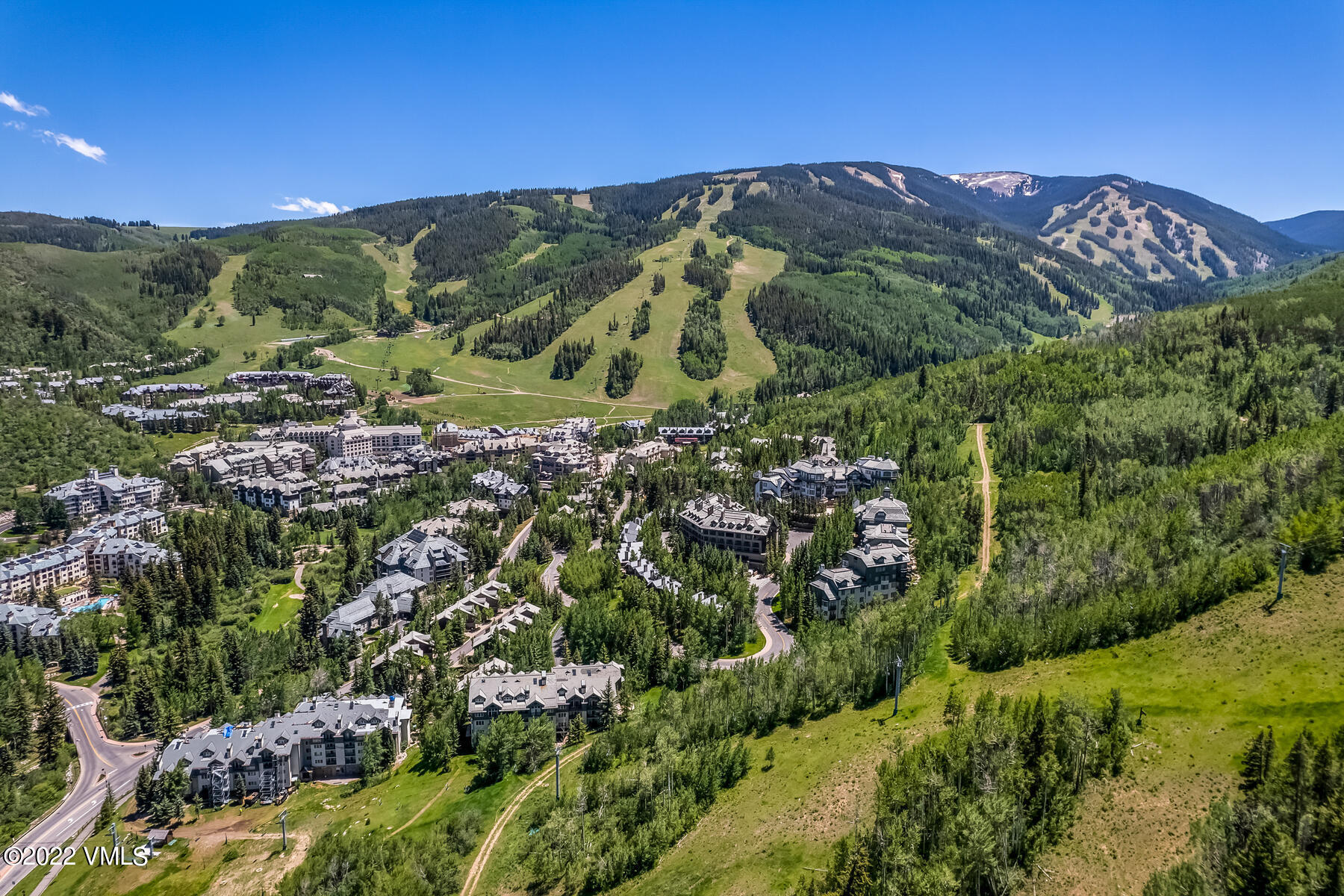 1120 Village Road, Unit 402 Beaver Creek, CO 81620 - Photo 41 of 46 a view of a city with mountains in the background