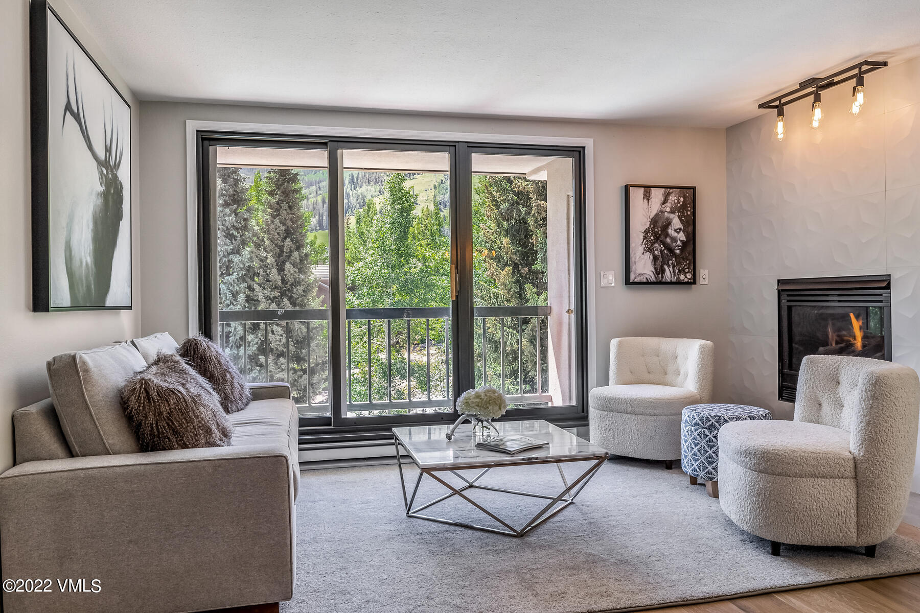 1120 Village Road, Unit 402 Beaver Creek, CO 81620 - Photo 5 of 46 a living room with furniture and a large window