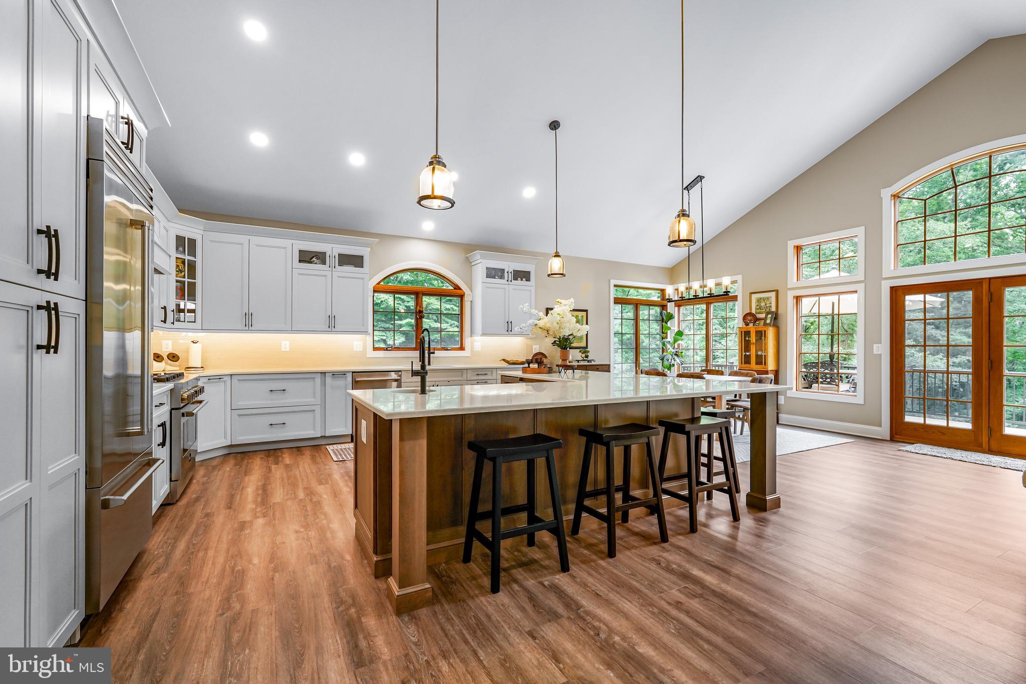 73 Dant Lane Elkton, MD 21921 - Photo 12 of 65 a kitchen with stainless steel appliances granite countertop a refrigerator a sink dishwasher a stove and white countertops with wooden floor