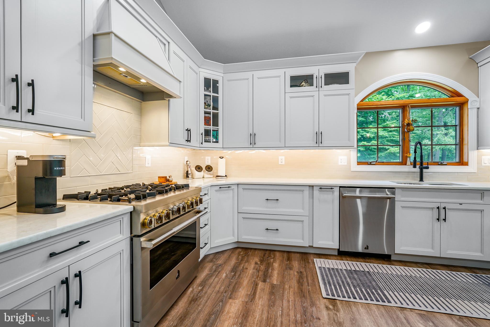 73 Dant Lane Elkton, MD 21921 - Photo 14 of 65 a kitchen with a stove a sink and a window