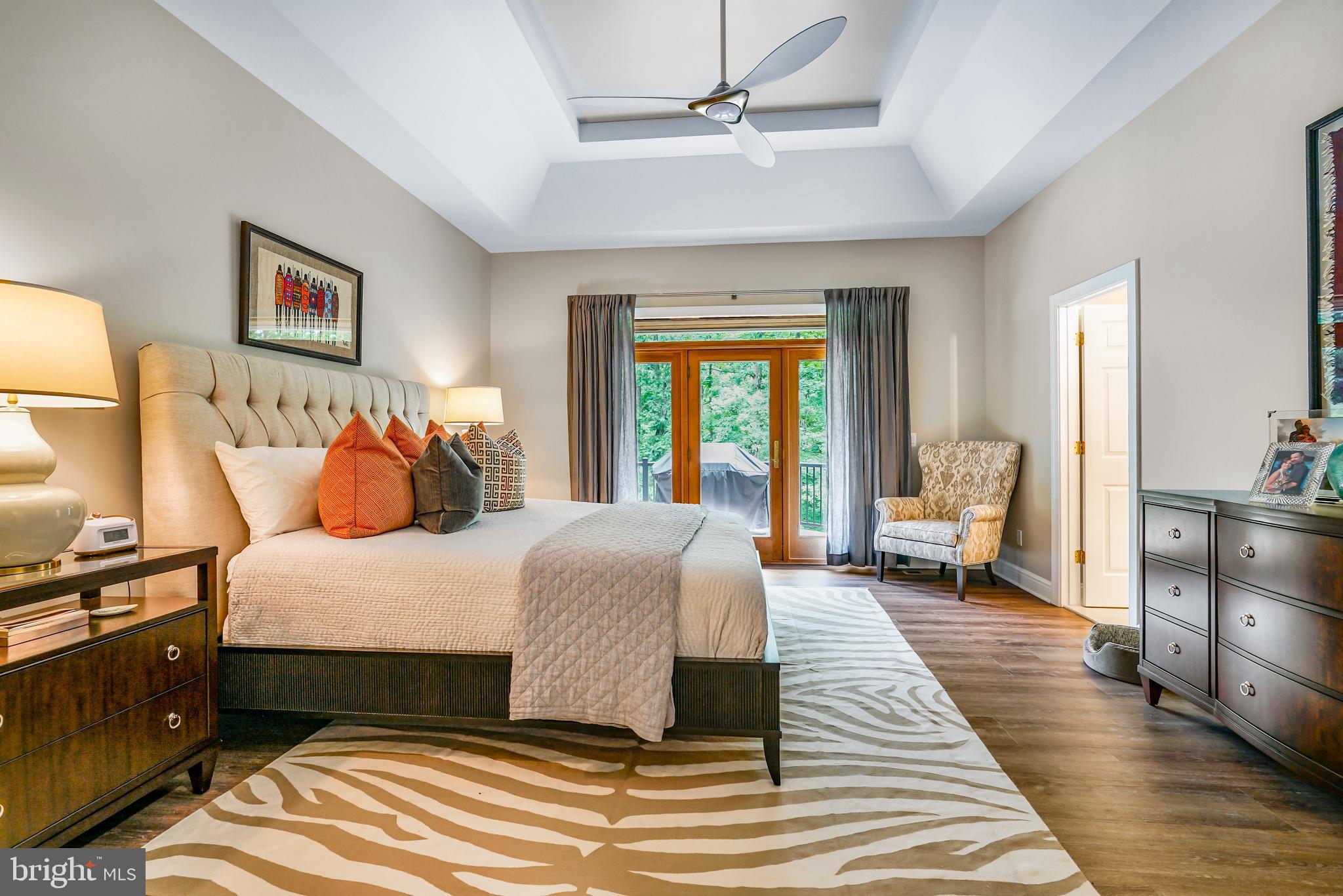 73 Dant Lane Elkton, MD 21921 - Photo 25 of 65 a bedroom with a large bed and a chandelier