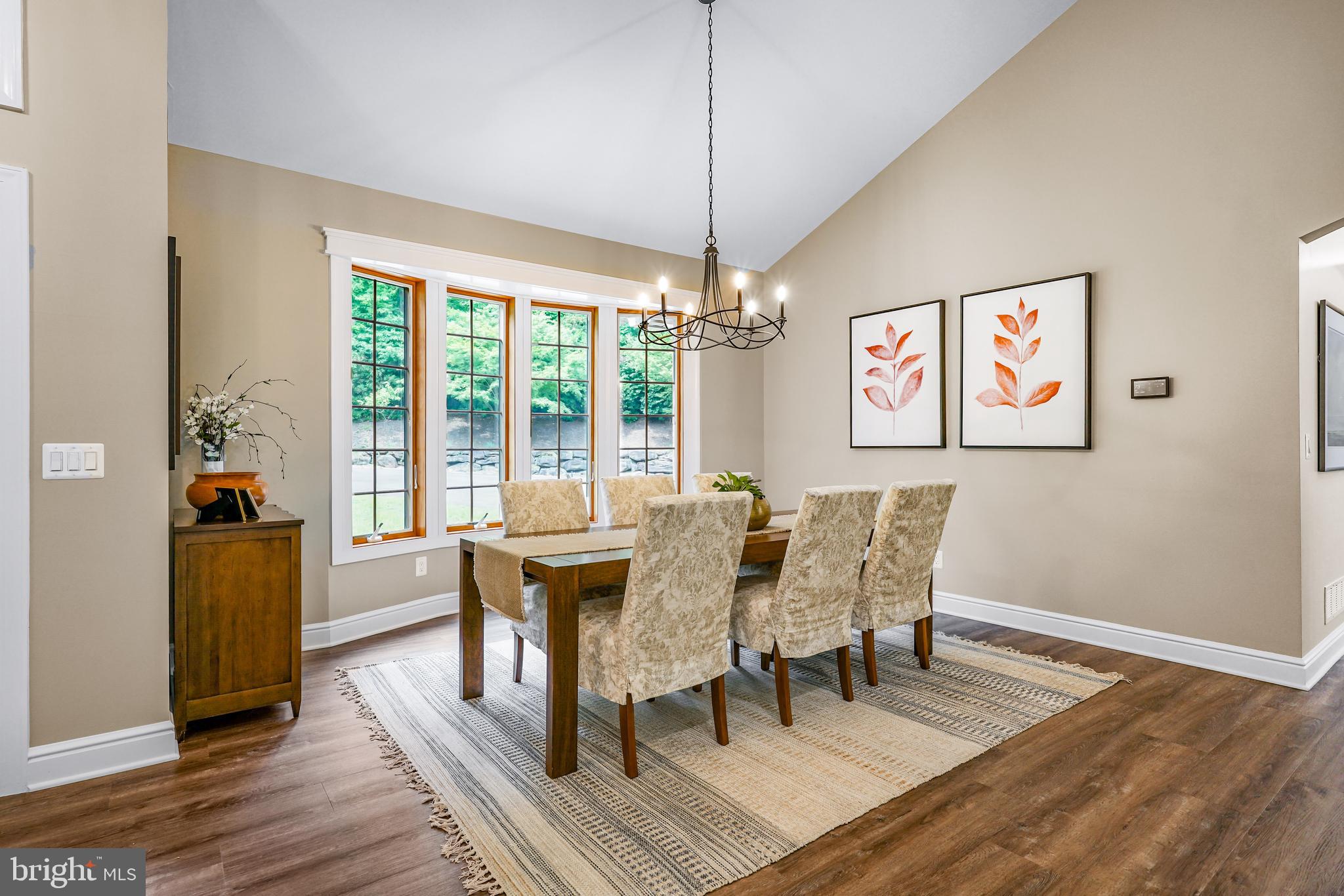 73 Dant Lane Elkton, MD 21921 - Photo 10 of 65 a view of a dining room with furniture wooden floor and chandelier