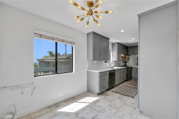 a view of entryway with wooden floor and stairs