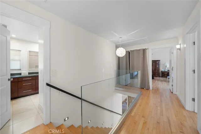a view of a hallway and wooden floor