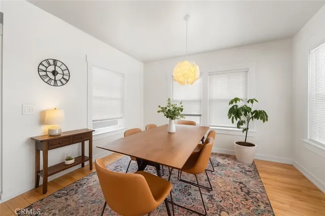 a view of a workspace room with furniture and a potted plant