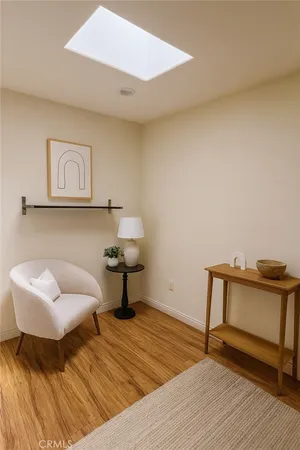 a bedroom with a bed and a chair