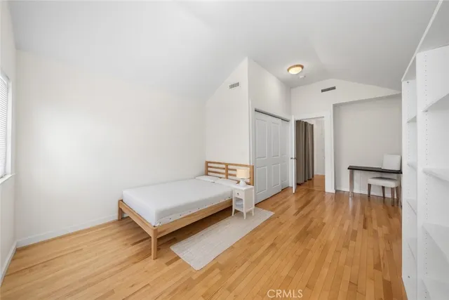 a spacious bedroom with a bed and a table