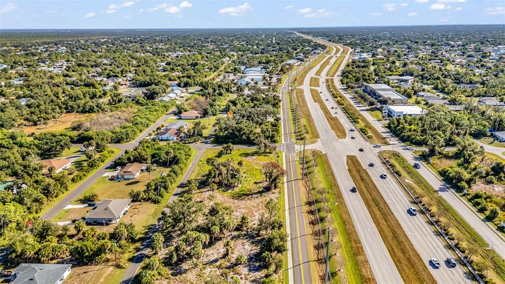 3280 North Access Road Englewood, FL 34224 - Photo 15 of 26 an aerial view of residential houses with outdoor space