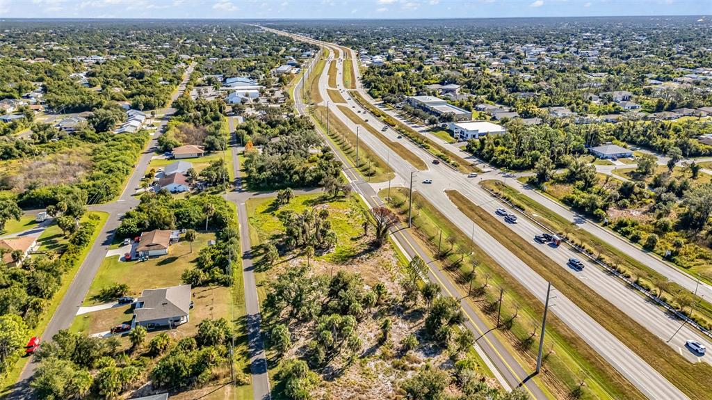 3280 North Access Road Englewood, FL 34224 - Photo 16 of 26 an aerial view of residential houses with outdoor space