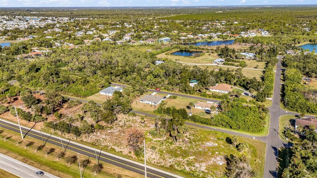 3280 North Access Road Englewood, FL 34224 - Photo 7 of 26 an aerial view of residential houses with outdoor space and swimming pool