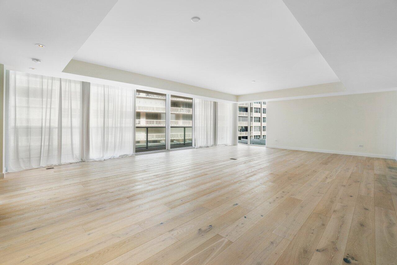 3550 South Ocean Boulevard, Unit 2D South Palm Beach, FL 33480 - Photo 12 of 55 wooden floor in an empty room with a window