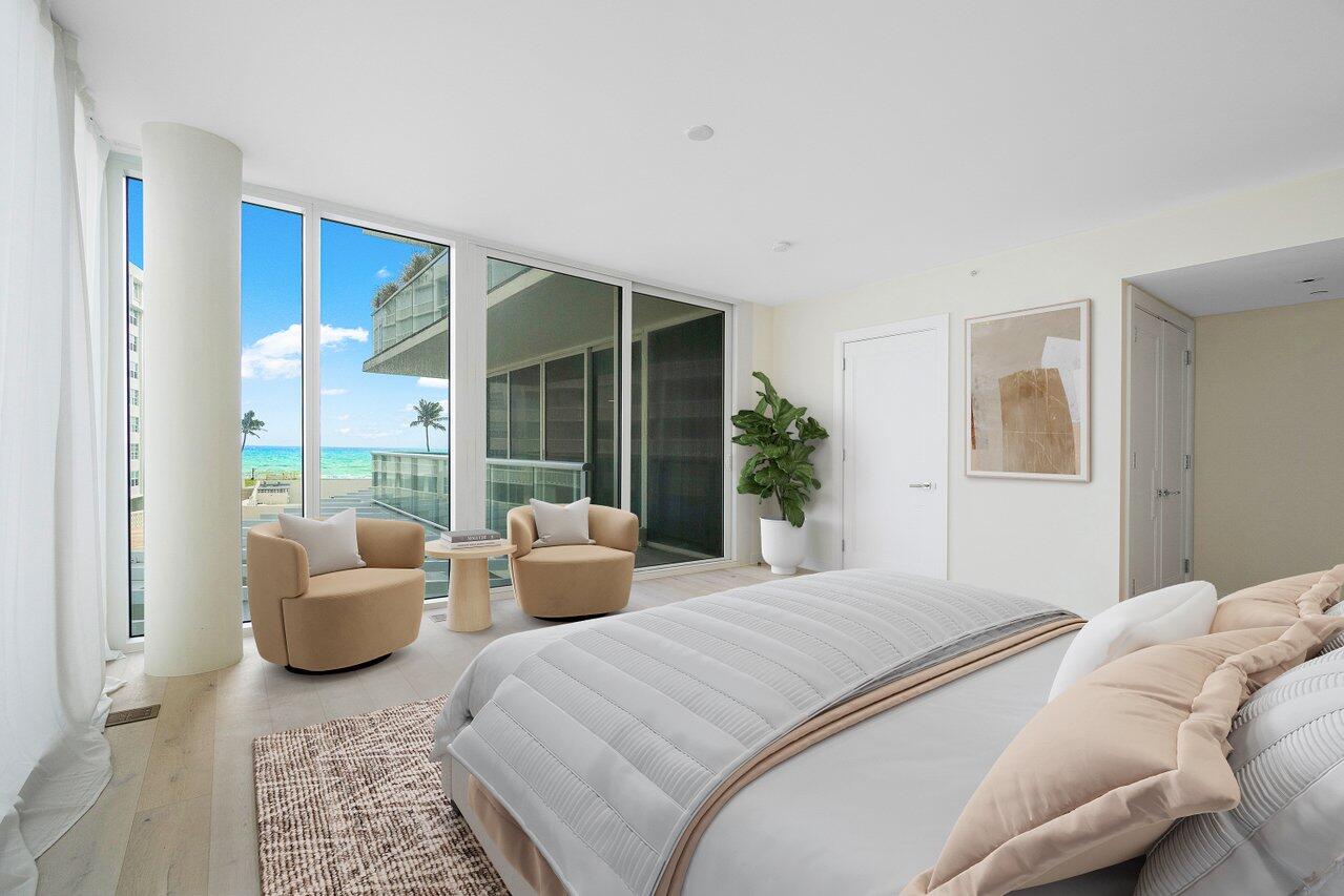 3550 South Ocean Boulevard, Unit 2D South Palm Beach, FL 33480 - Photo 13 of 55 a bedroom with furniture and a large window