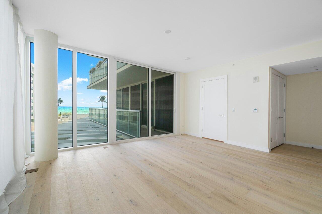 3550 South Ocean Boulevard, Unit 2D South Palm Beach, FL 33480 - Photo 14 of 55 a view of empty room with wooden floor
