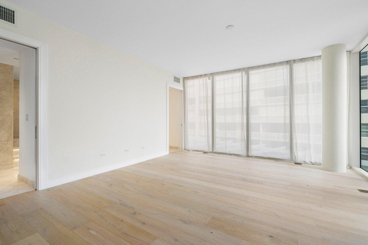 3550 South Ocean Boulevard, Unit 2D South Palm Beach, FL 33480 - Photo 15 of 55 a view of an empty room with a window