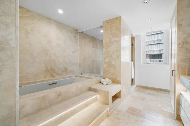 a bathroom with a shower and a toilet