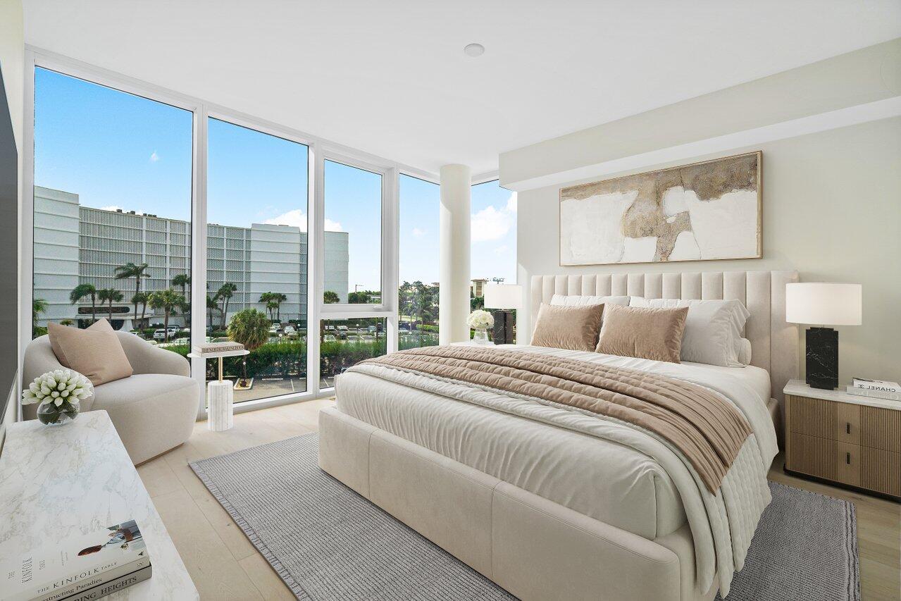 3550 South Ocean Boulevard, Unit 2D South Palm Beach, FL 33480 - Photo 20 of 55 a spacious bedroom with a large bed and a large window