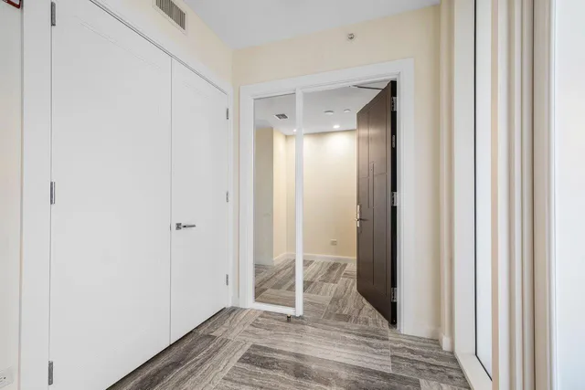 a view of a bathroom with sink and shower