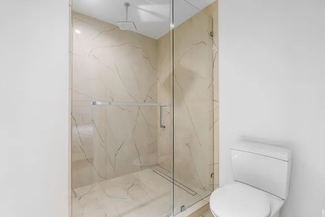 a bathroom with a sink toilet and vanity