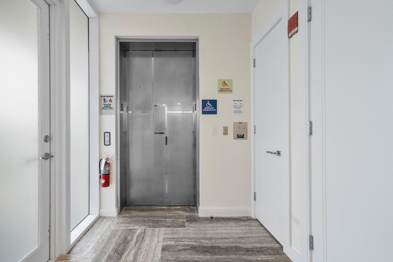 3550 South Ocean Boulevard, Unit 2D South Palm Beach, FL 33480 - Photo 32 of 55 a view of a hallway with wooden floor and closet area