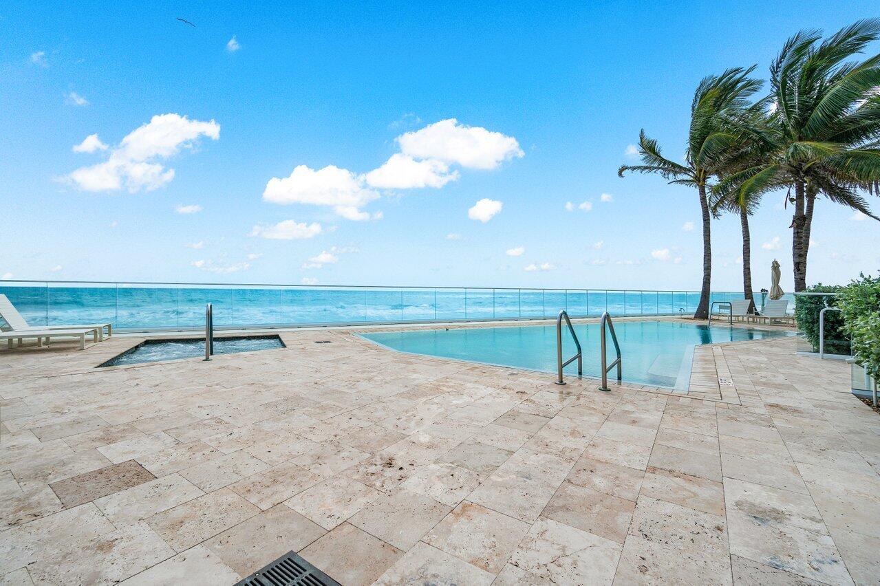 3550 South Ocean Boulevard, Unit 2D South Palm Beach, FL 33480 - Photo 38 of 55 a view of a lake with a beach