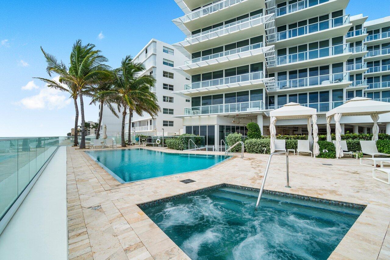 3550 South Ocean Boulevard, Unit 2D South Palm Beach, FL 33480 - Photo 40 of 55 a view of a yard with a patio