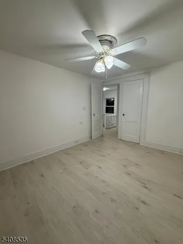 a large kitchen with a stove and a refrigerator