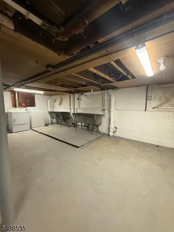 an empty room with closet and windows