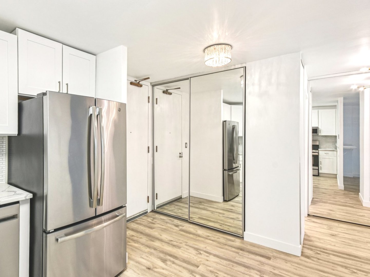 400 East Randolph Street, Unit 1804 Chicago, IL 60601 - Photo 11 of 28 a metallic refrigerator freezer sitting inside of a kitchen
