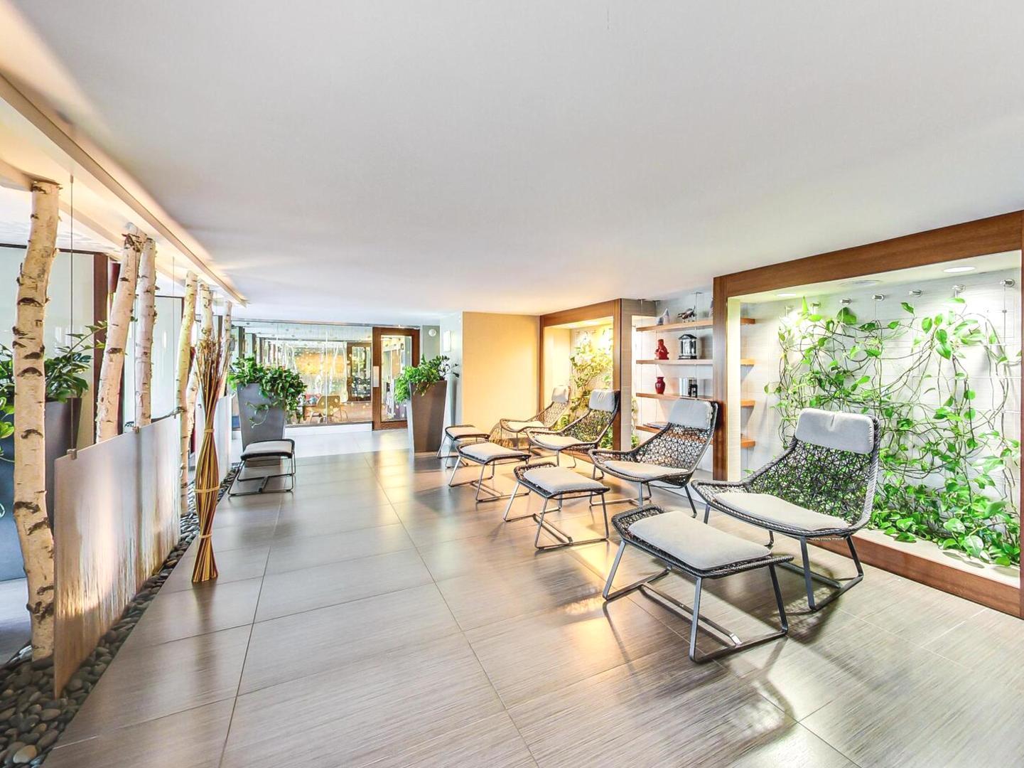 400 East Randolph Street, Unit 1804 Chicago, IL 60601 - Photo 24 of 28 a living room with furniture and a large window