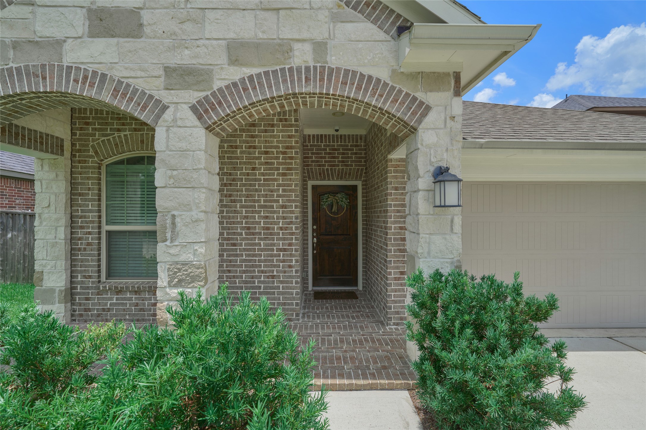 116 Fox Trail Road Montgomery, TX 77316 - Photo 2 of 50 Covered porch and arched entrance lead to the solid wood front door.