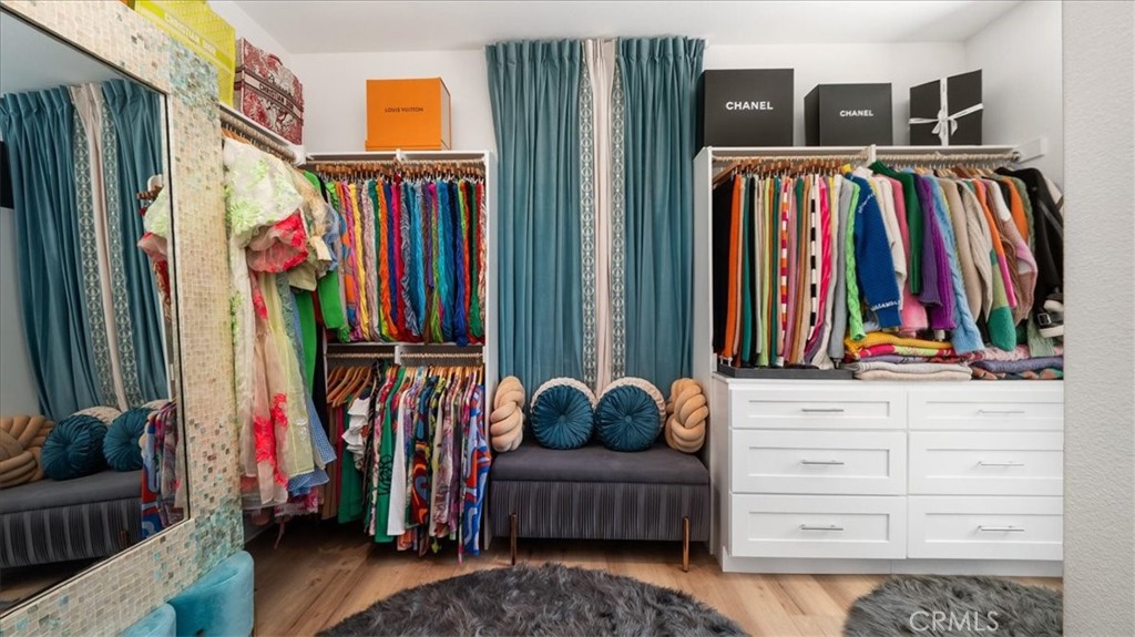8798 JUSTIFY Drive Rancho Cucamonga, CA 91701 - Photo 13 of 26 a view of walk in closet with clothes