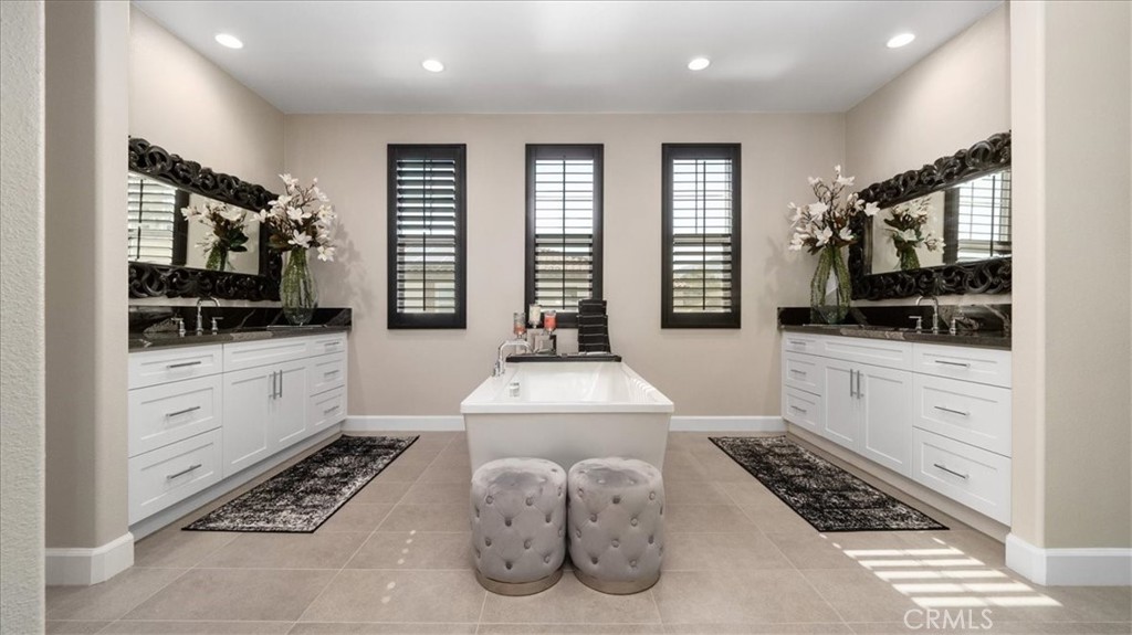 8798 JUSTIFY Drive Rancho Cucamonga, CA 91701 - Photo 15 of 26 a kitchen with stainless steel appliances kitchen island granite countertop a stove and cabinets