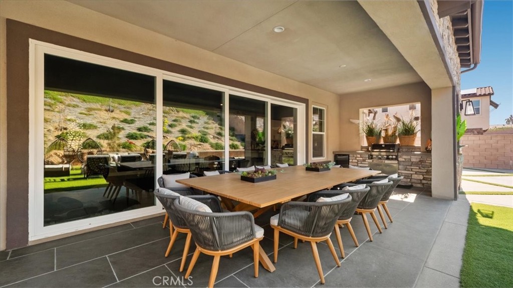8798 JUSTIFY Drive Rancho Cucamonga, CA 91701 - Photo 23 of 26 a dining room with furniture and window