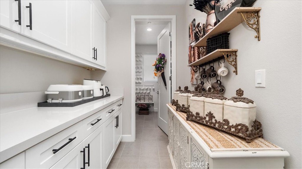 8798 JUSTIFY Drive Rancho Cucamonga, CA 91701 - Photo 7 of 26 a kitchen with a stove and cabinets
