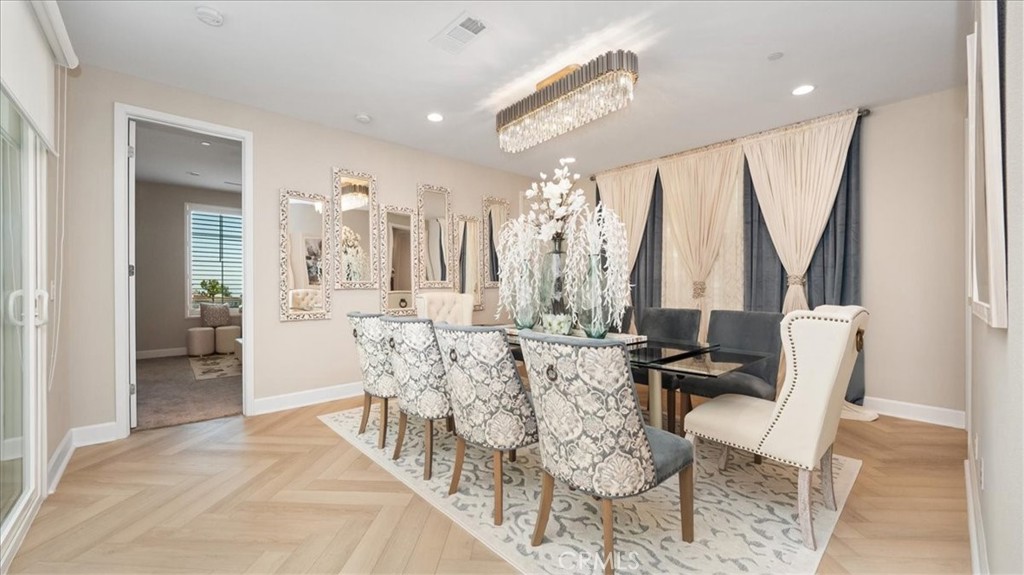 8798 JUSTIFY Drive Rancho Cucamonga, CA 91701 - Photo 9 of 26 a living room with furniture and a large window