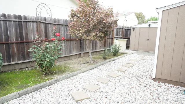 a view of a backyard with a small cabin