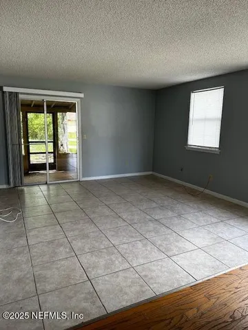 a view of an empty room and window