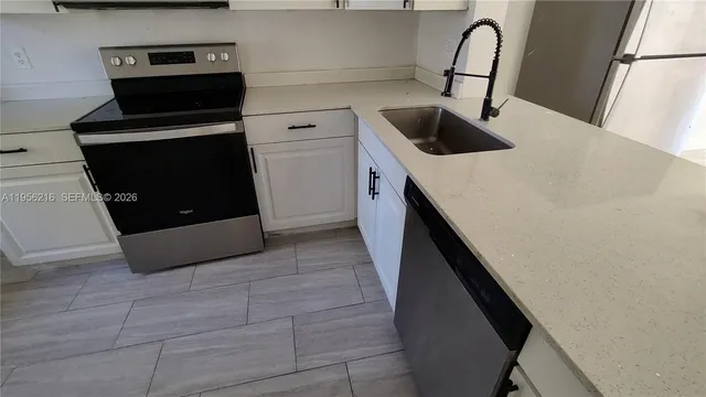 a kitchen with a stove and a microwave