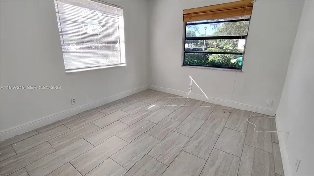 an empty room with windows