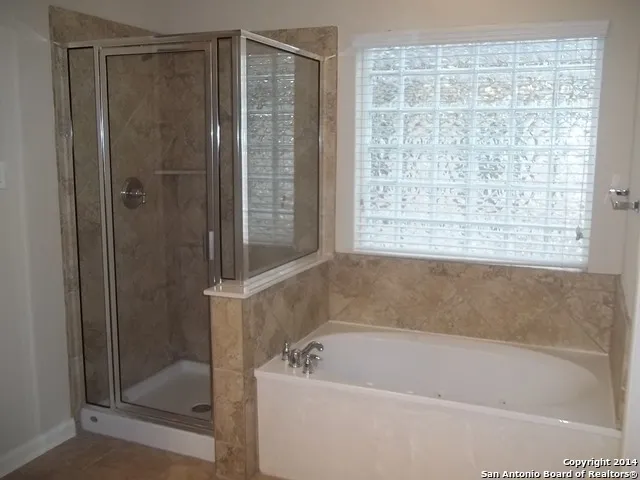 a bathroom with a sink double vanity and a mirror