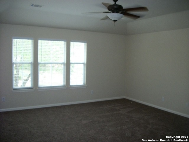16202 Juan Tabo Way Helotes, TX 78023 - Photo 16 of 22 an empty room with a window