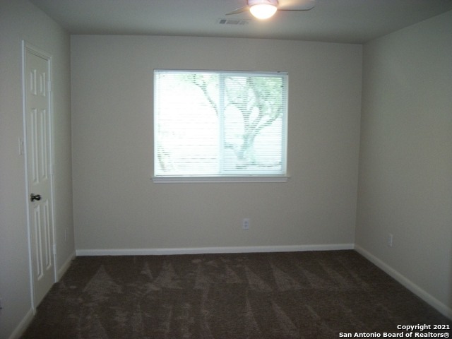 16202 Juan Tabo Way Helotes, TX 78023 - Photo 18 of 22 an empty room with a window