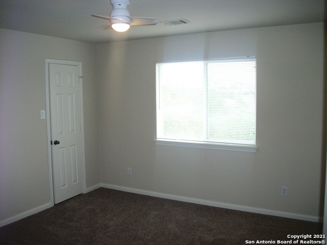 16202 Juan Tabo Way Helotes, TX 78023 - Photo 19 of 22 an empty room with a window