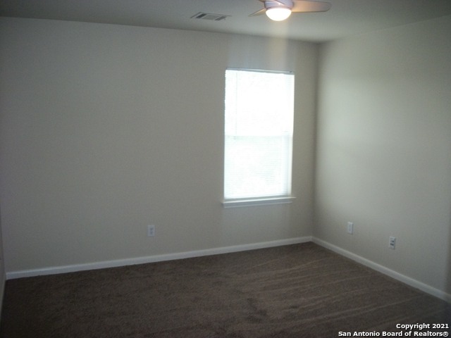 16202 Juan Tabo Way Helotes, TX 78023 - Photo 20 of 22 an empty room with a window