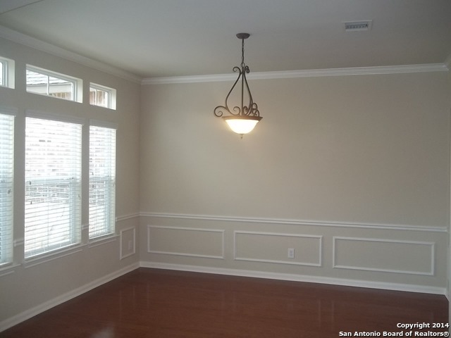 16202 Juan Tabo Way Helotes, TX 78023 - Photo 4 of 22 a view of an empty room with a window